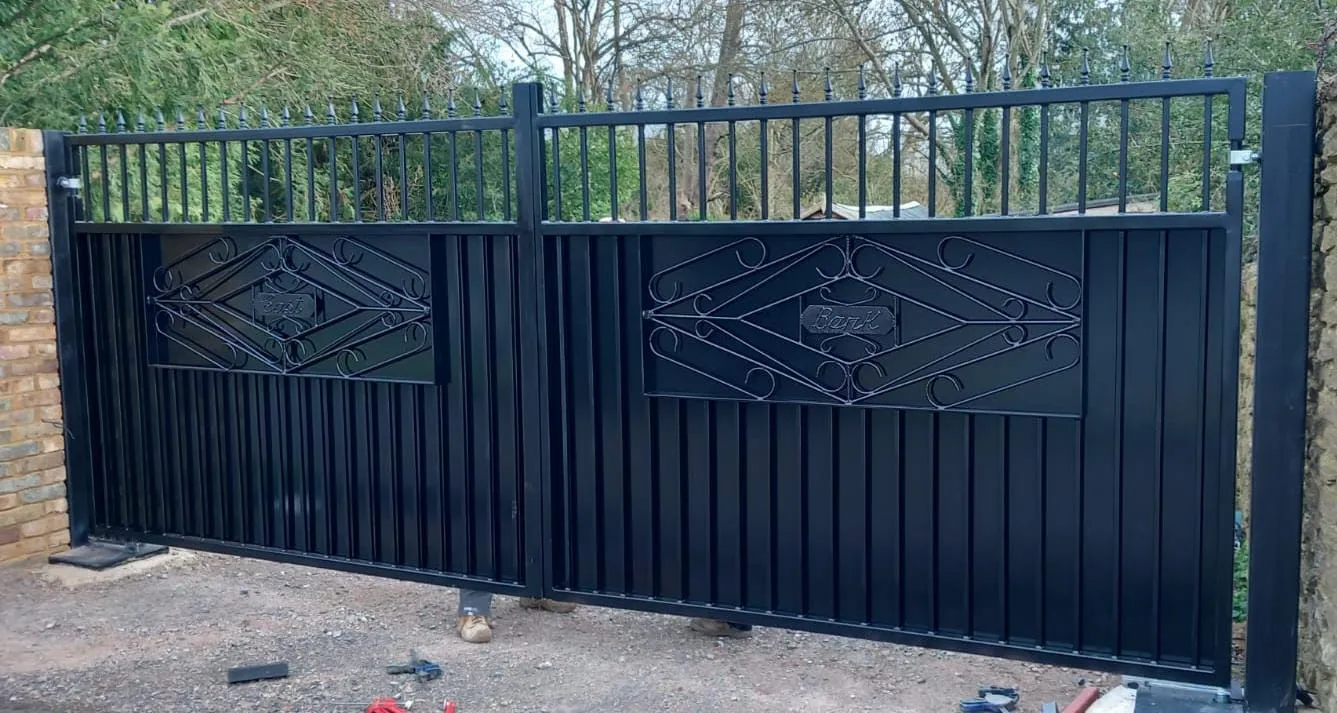 A black gate with a design on it.