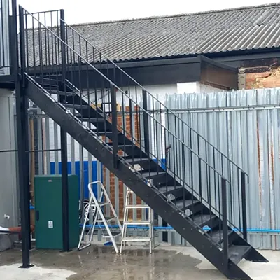 a set of stairs next to a building