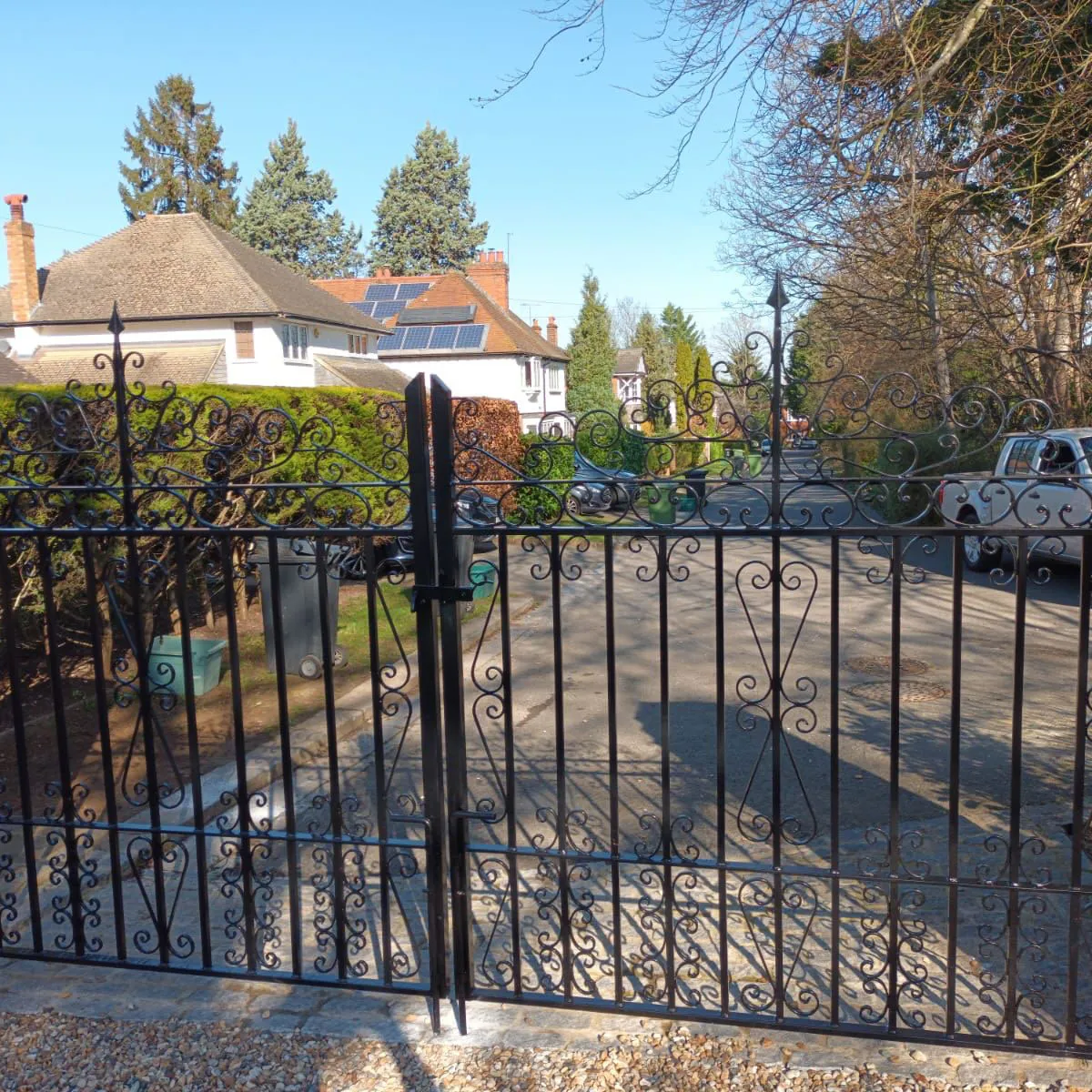 a black iron fence in front of a house