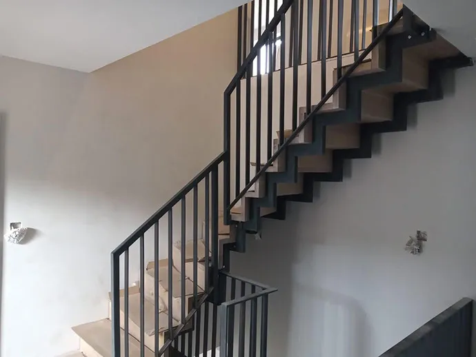A black and white staircase in a house.